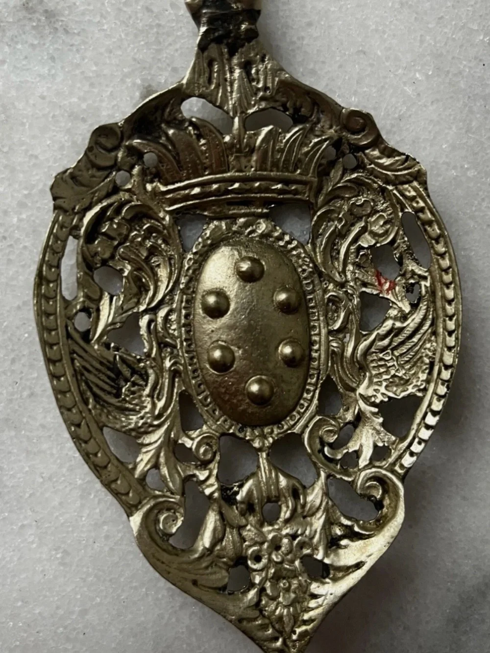 vintage Italian serving utensils are an ornate brass fork and spoon set